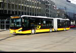 Postauto - MAN Lion`s City Hybrid TG 52208 unterwegs vor dem Bhf.