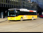 Postauto - Iveco Crossway  AR 14853 unterwegs vor dem Bhf.