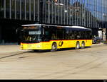 Postauto - MAN Lion`s City  SG 169914 unterwegs vor dem Bhf.